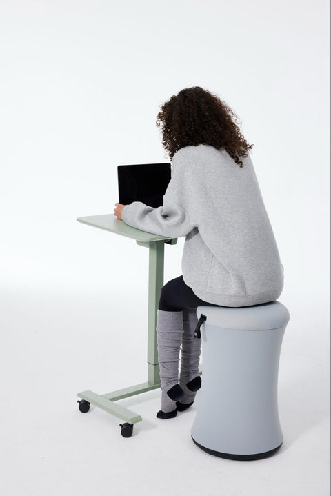 Woman Sitting on a BOBA Chair while Using an AnyDesk Fold from TopJob 